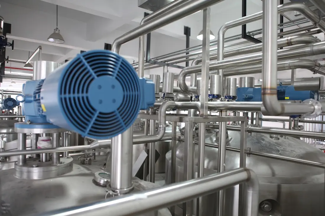 Stainless steel piping inside an industrial plant