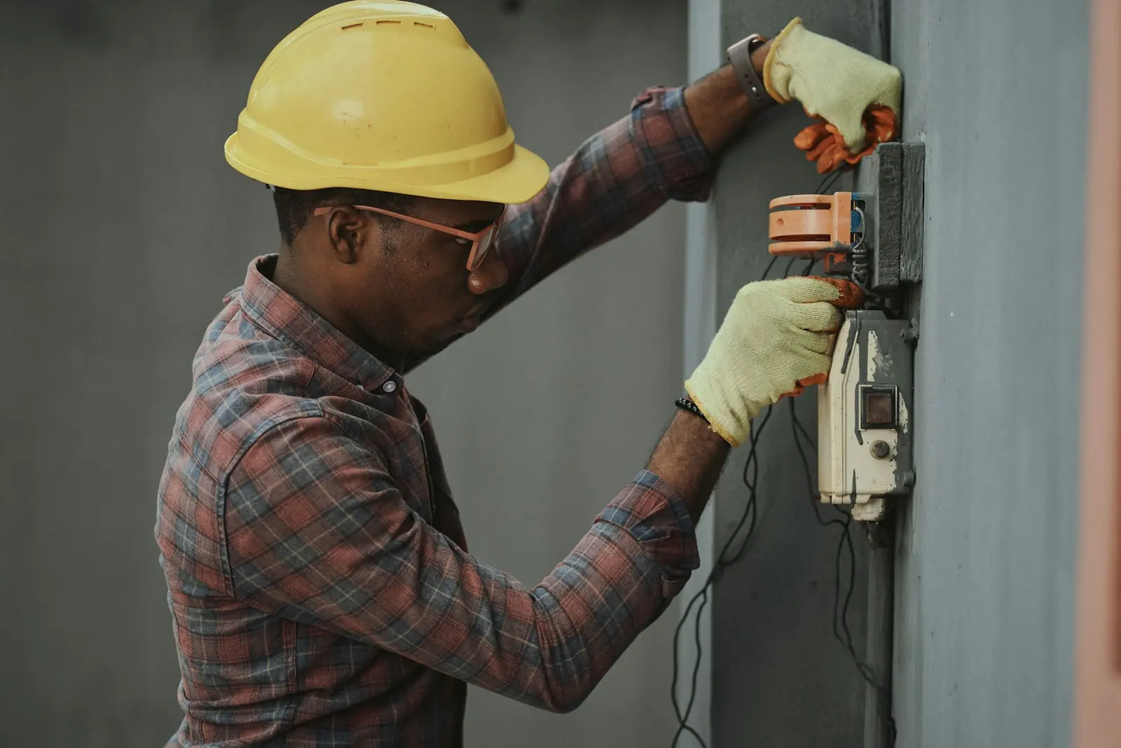 Electrician carrying out industrial MEP services